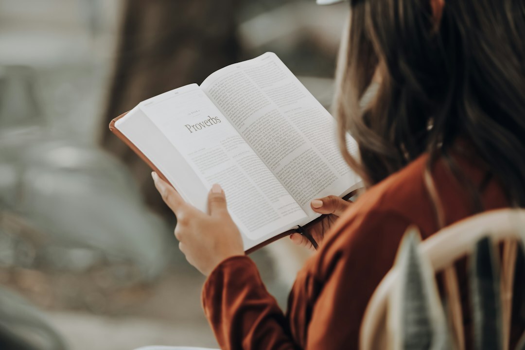 person reading mystery book
