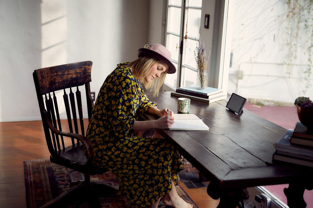 writer revising manuscript